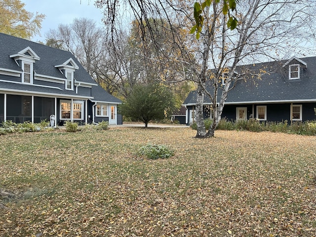 view of yard with a sunroom