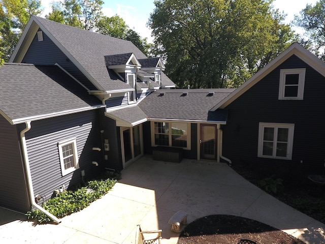 back of house with a patio