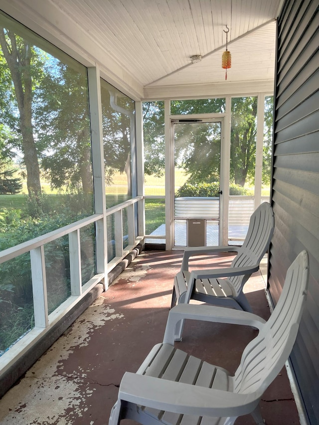 sunroom with wood ceiling and vaulted ceiling