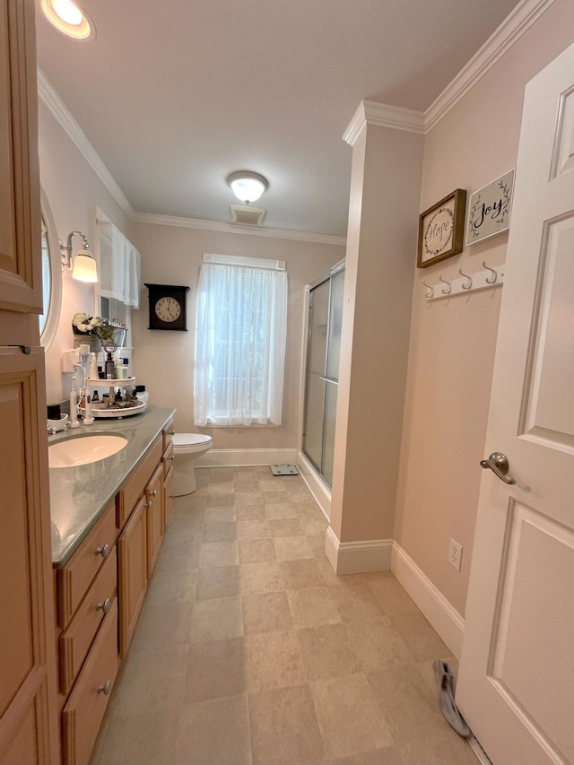 bathroom featuring vanity, ornamental molding, an enclosed shower, and toilet