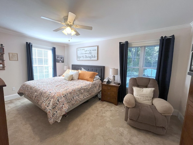 carpeted bedroom featuring crown molding and ceiling fan