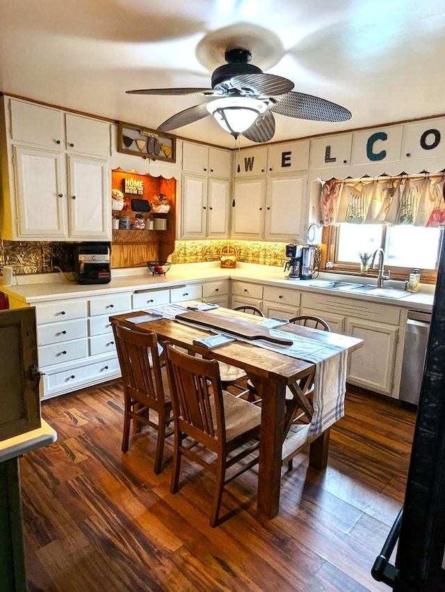 506 Ash Ave N, New Richland, MN 56072 - kitchen featuring dark wood finished floors, light countertops, a sink, decorative backsplash, and ceiling fan