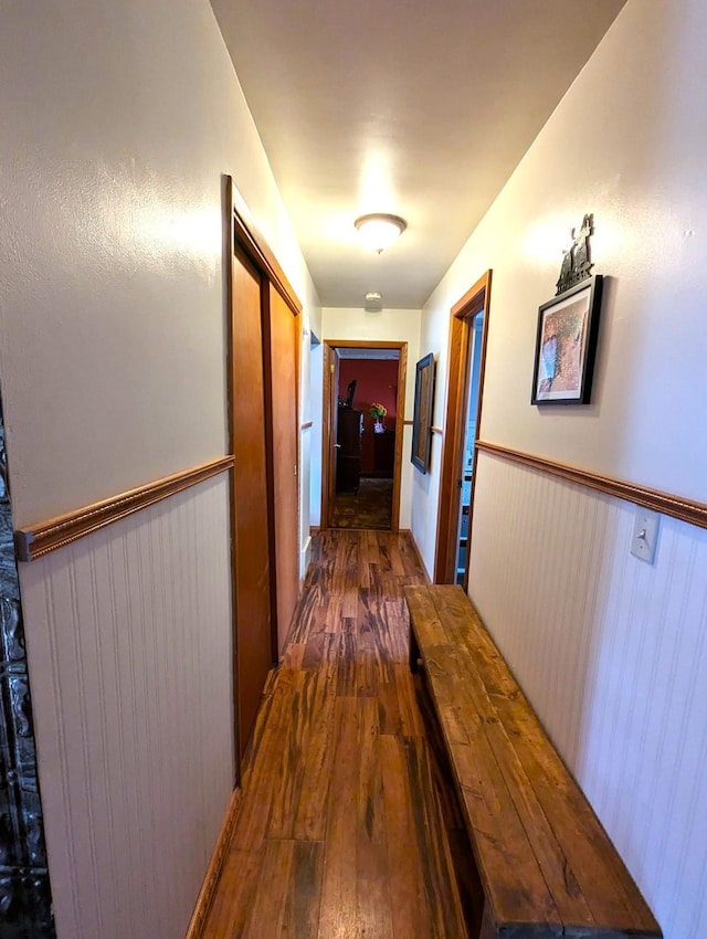 506 Ash Ave N, New Richland, MN 56072 - hallway featuring wainscoting and wood-type flooring