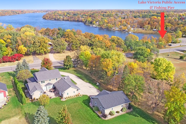 bird's eye view with a forest view and a water view