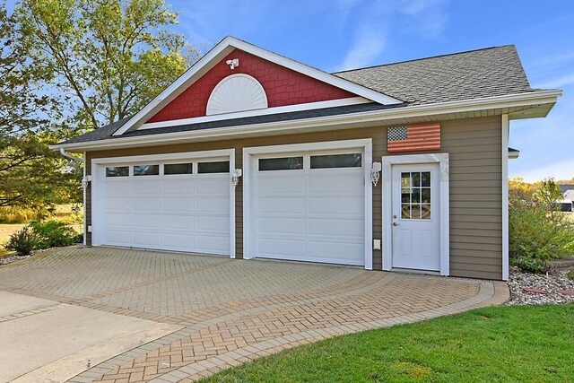 2002 Hazel Hill Rd SE, Alexandria, MN 56308 - garage featuring decorative driveway