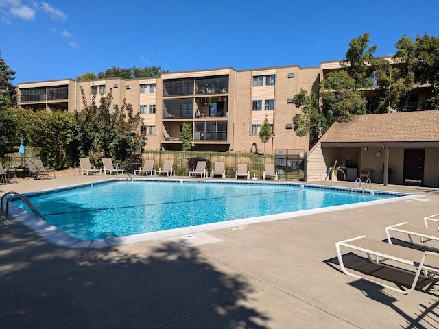 view of swimming pool featuring a patio area