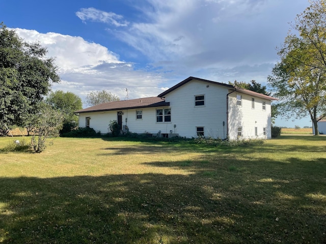 view of home's exterior with a yard