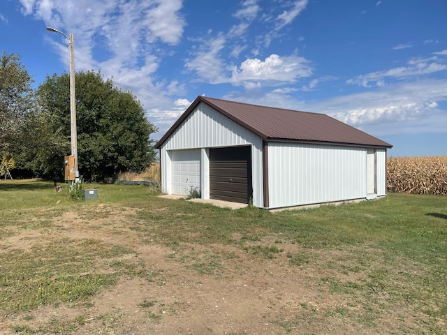 garage featuring a yard