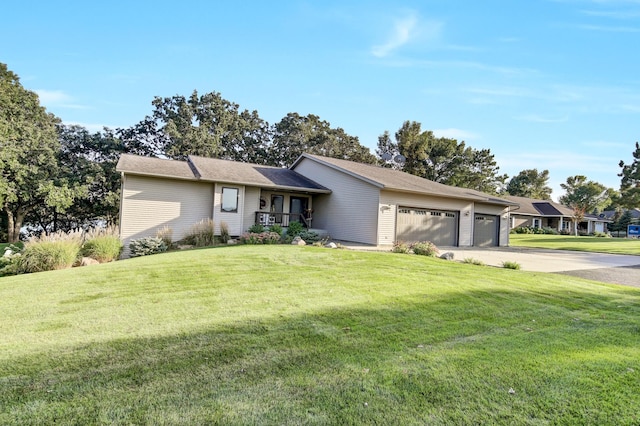 ranch-style home featuring a garage and a front yard