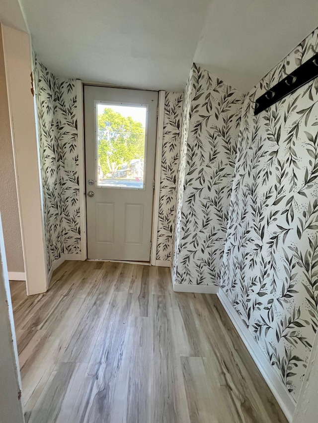 511 Division St N, Clara City, MN 56222 - interior space with wallpapered walls and wood finished floors