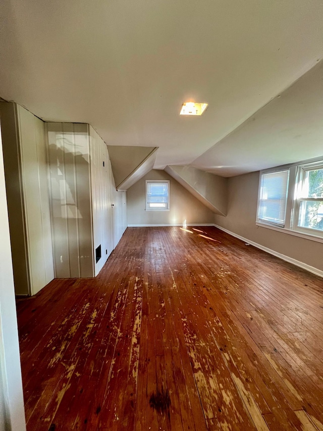 511 Division St N, Clara City, MN 56222 - additional living space with baseboards, lofted ceiling, and wood-type flooring