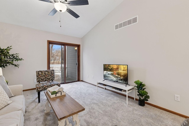 carpeted living room featuring baseboards, a ceiling fan, visible vents, and high vaulted ceiling