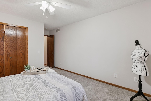 bedroom featuring carpet floors, visible vents, a ceiling fan, and baseboards