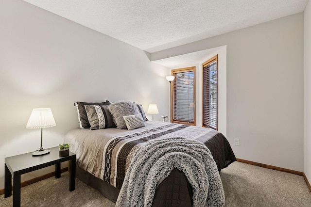 bedroom with carpet and baseboards