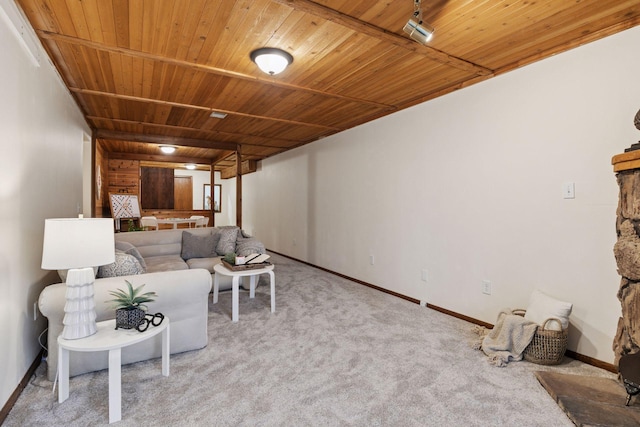 carpeted living room featuring wooden ceiling and baseboards