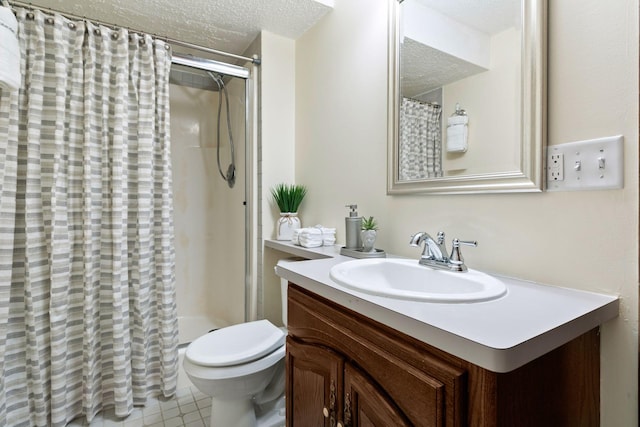 full bathroom with toilet, vanity, a textured ceiling, and a stall shower