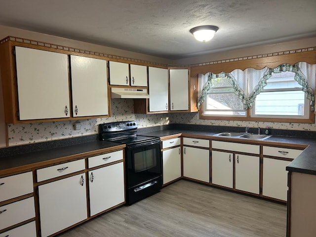 kitchen featuring light wood-type flooring, a textured ceiling, sink, white cabinets, and black electric range oven