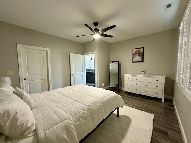 bedroom with dark hardwood / wood-style flooring and ceiling fan