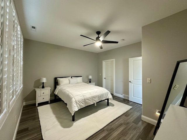 bedroom featuring ceiling fan and dark wood-type flooring