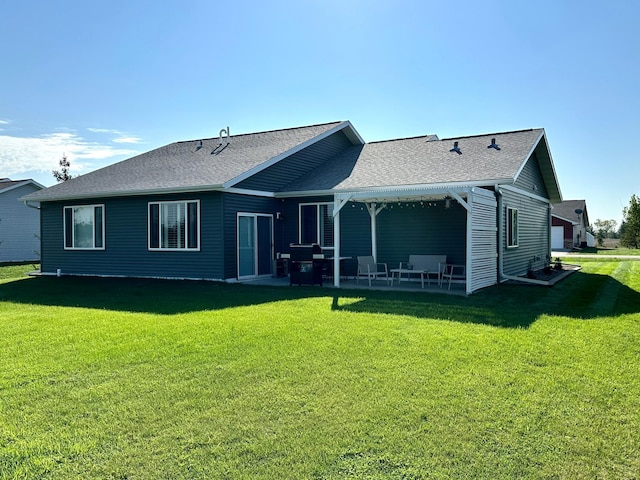 back of property with a patio and a lawn