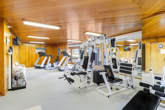 workout area with carpet floors, wooden walls, vaulted ceiling, and wooden ceiling