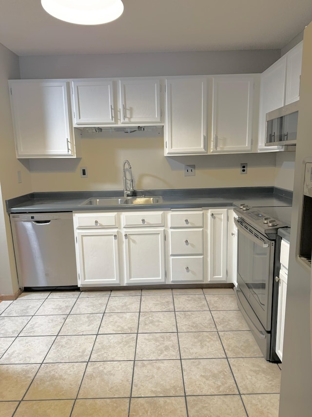 kitchen with white cabinets, light tile patterned floors, sink, and appliances with stainless steel finishes