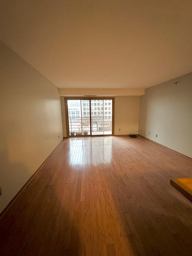 spare room featuring hardwood / wood-style flooring