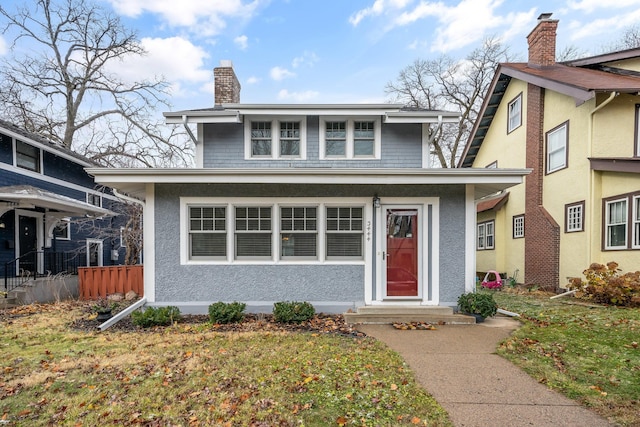 view of front property featuring a front lawn