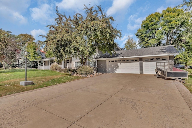 view of front of home featuring a garage and a front lawn