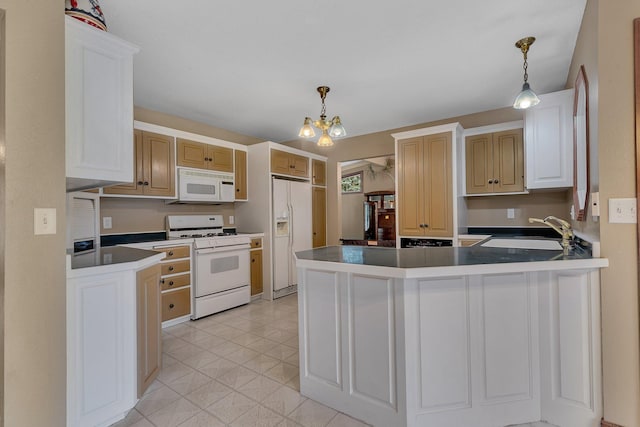 kitchen with light tile patterned flooring, sink, decorative light fixtures, kitchen peninsula, and white appliances