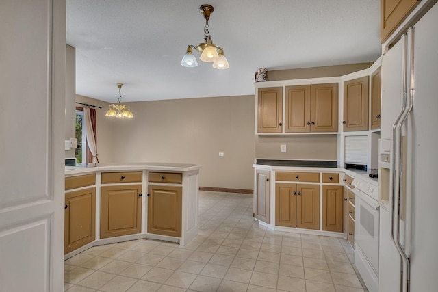 kitchen featuring pendant lighting, white refrigerator with ice dispenser, kitchen peninsula, and a chandelier