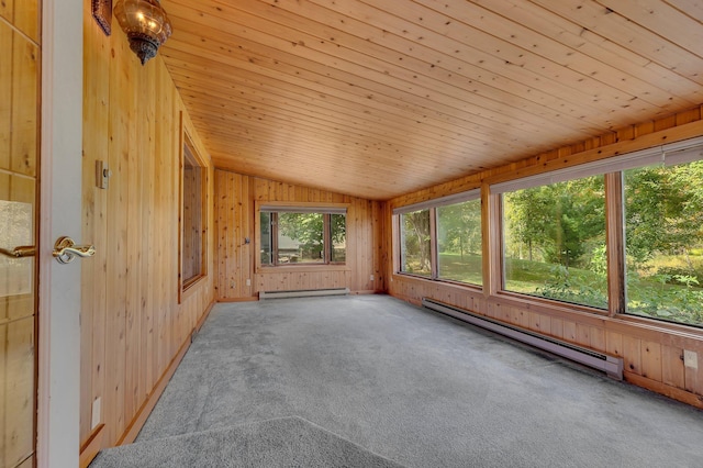 unfurnished sunroom with a baseboard radiator, vaulted ceiling, and plenty of natural light