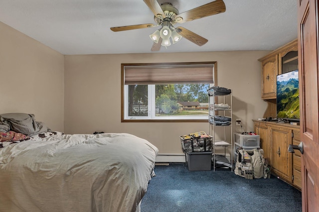 bedroom with a baseboard heating unit and ceiling fan