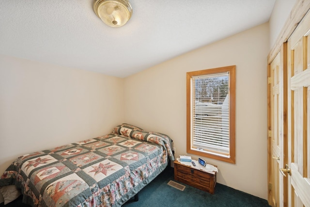 bedroom featuring carpet and vaulted ceiling