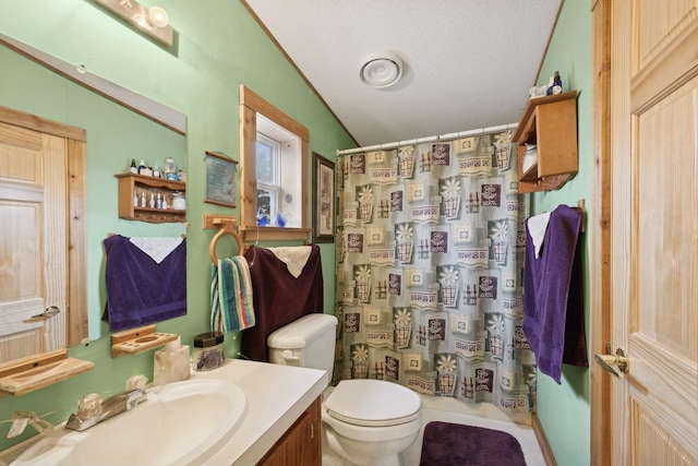 bathroom with a textured ceiling, vaulted ceiling, vanity, toilet, and a shower with shower curtain