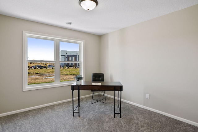 office space with a textured ceiling and carpet