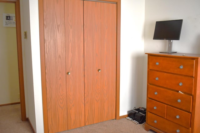 carpeted bedroom with a closet