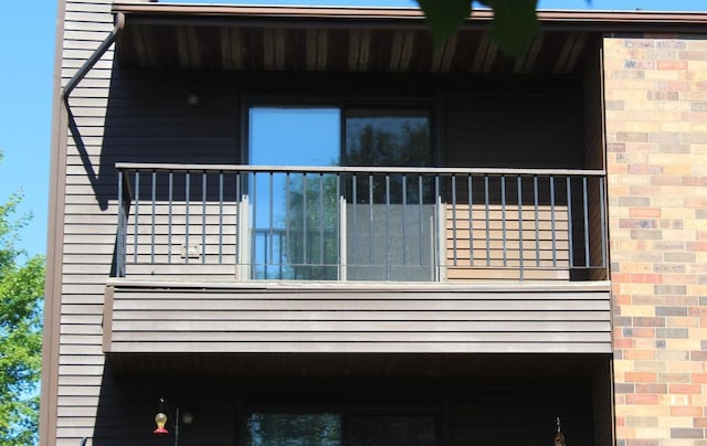 view of side of home with a balcony