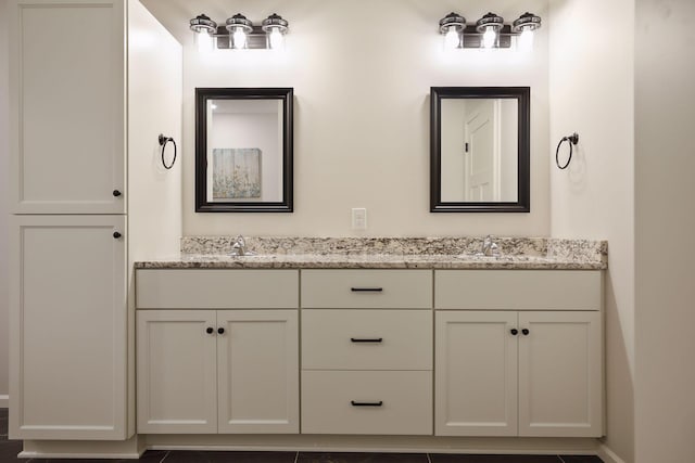 bathroom with vanity and tile patterned floors