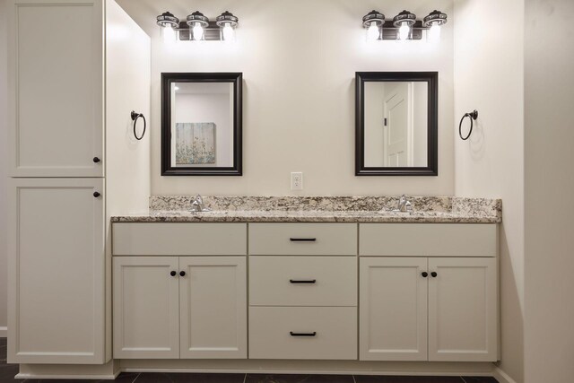 20092 Fitzgerald Trl N, Forest Lake, MN 55025 - full bathroom featuring double vanity and baseboards