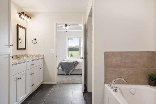 20092 Fitzgerald Trl N, Forest Lake, MN 55025 - full bath with ceiling fan, vanity, a garden tub, tile patterned floors, and baseboards