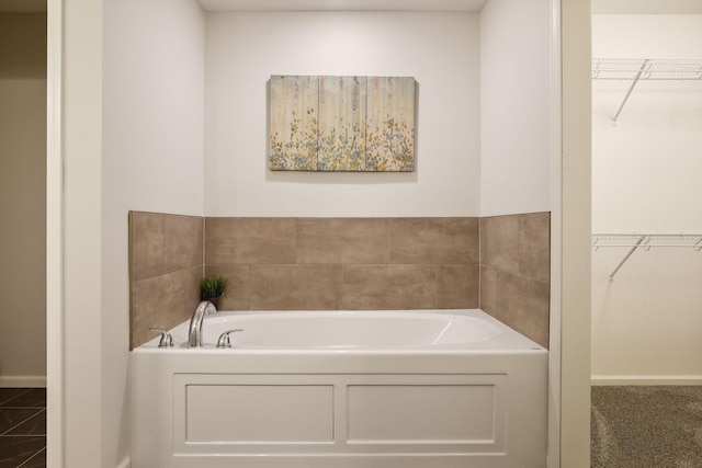 20092 Fitzgerald Trl N, Forest Lake, MN 55025 - full bathroom featuring a walk in closet, a garden tub, and baseboards