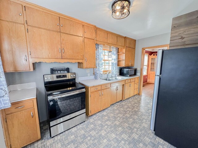 kitchen with appliances with stainless steel finishes and sink