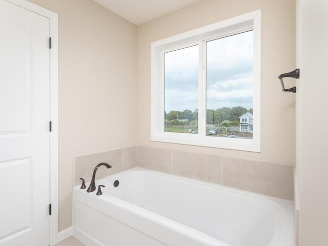 bathroom featuring a washtub