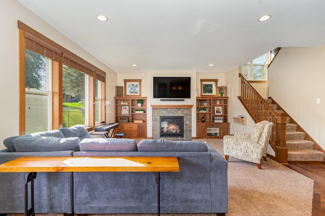 living room featuring hardwood / wood-style flooring and a fireplace