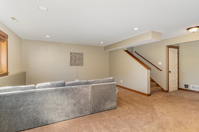 unfurnished living room featuring light colored carpet