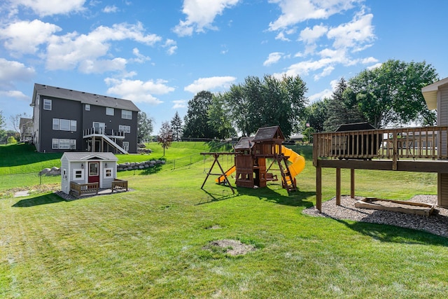 view of yard with a playground and a wooden deck