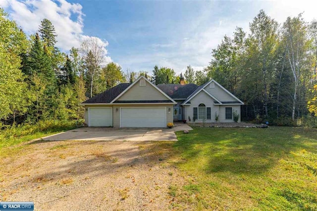 ranch-style home with a front lawn and a garage