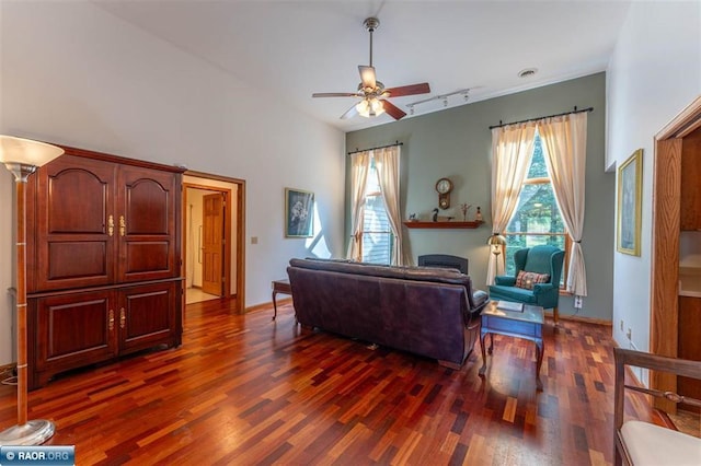 living room featuring dark hardwood / wood-style flooring and ceiling fan