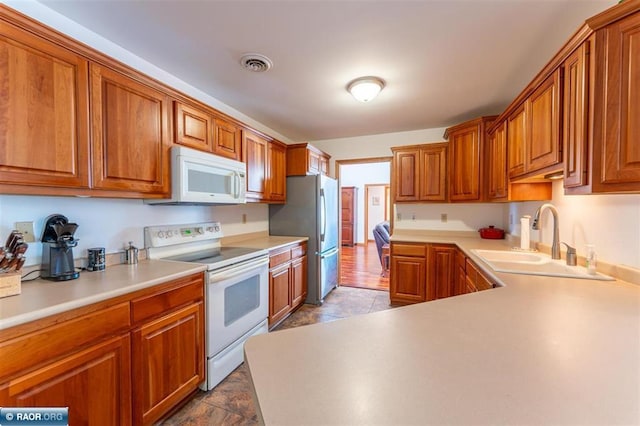 kitchen with white appliances and sink